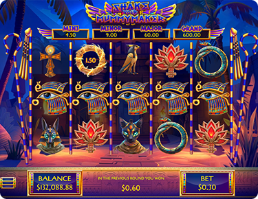 A screenshot of the reels of Shake Your Mummymaker slot game that was released in October at Desert nights Online Casino there are ancient egyptian symbols all over the reels and a beautiful, mystical background setting featuring palm trees and lucky artefacts